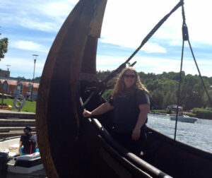 Melissa standing on a viking ship